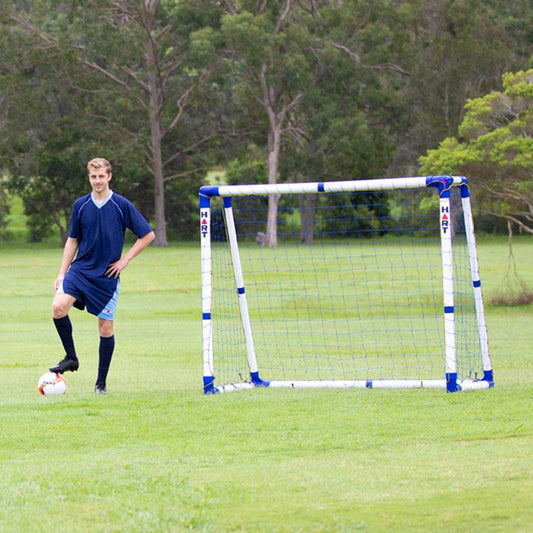 HART Pro Sports Goal in a backyard setting, featuring a sturdy metal frame and net for soccer practice and games.